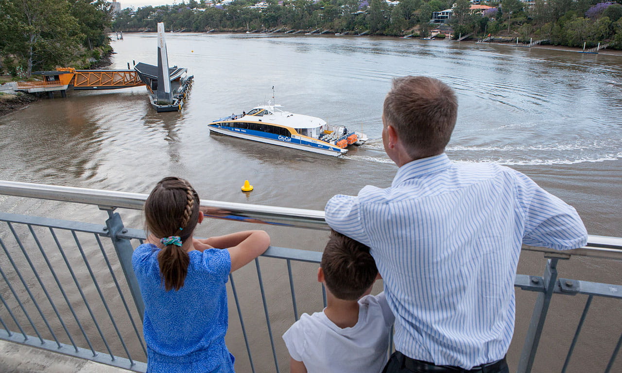 Aurecon's Arne Nilsen and children look across to the University of Queensland Ferry Terminal, part of the multi award-winning Brisbane Ferry Terminals project.