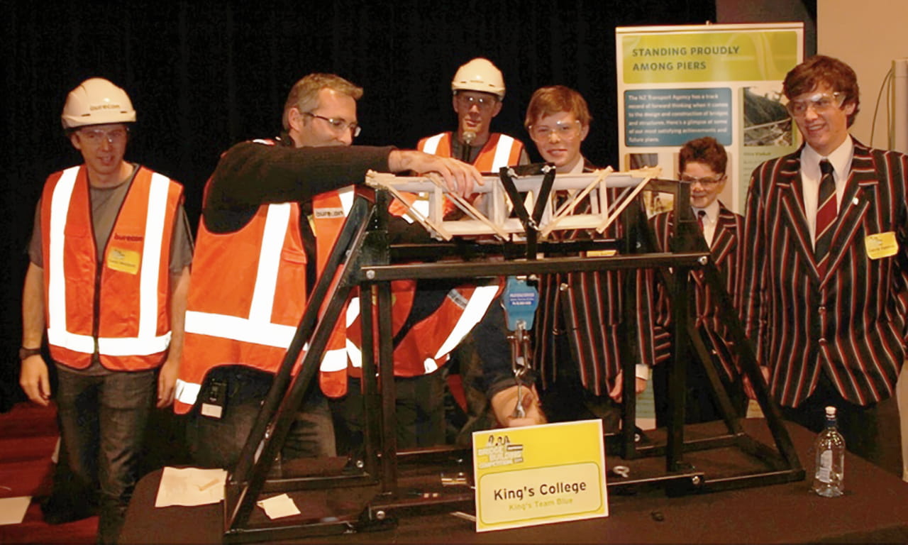 The Aurecon Bridge Building Competition's winning bridge held 128 kg, and was won by King's College, Auckland.