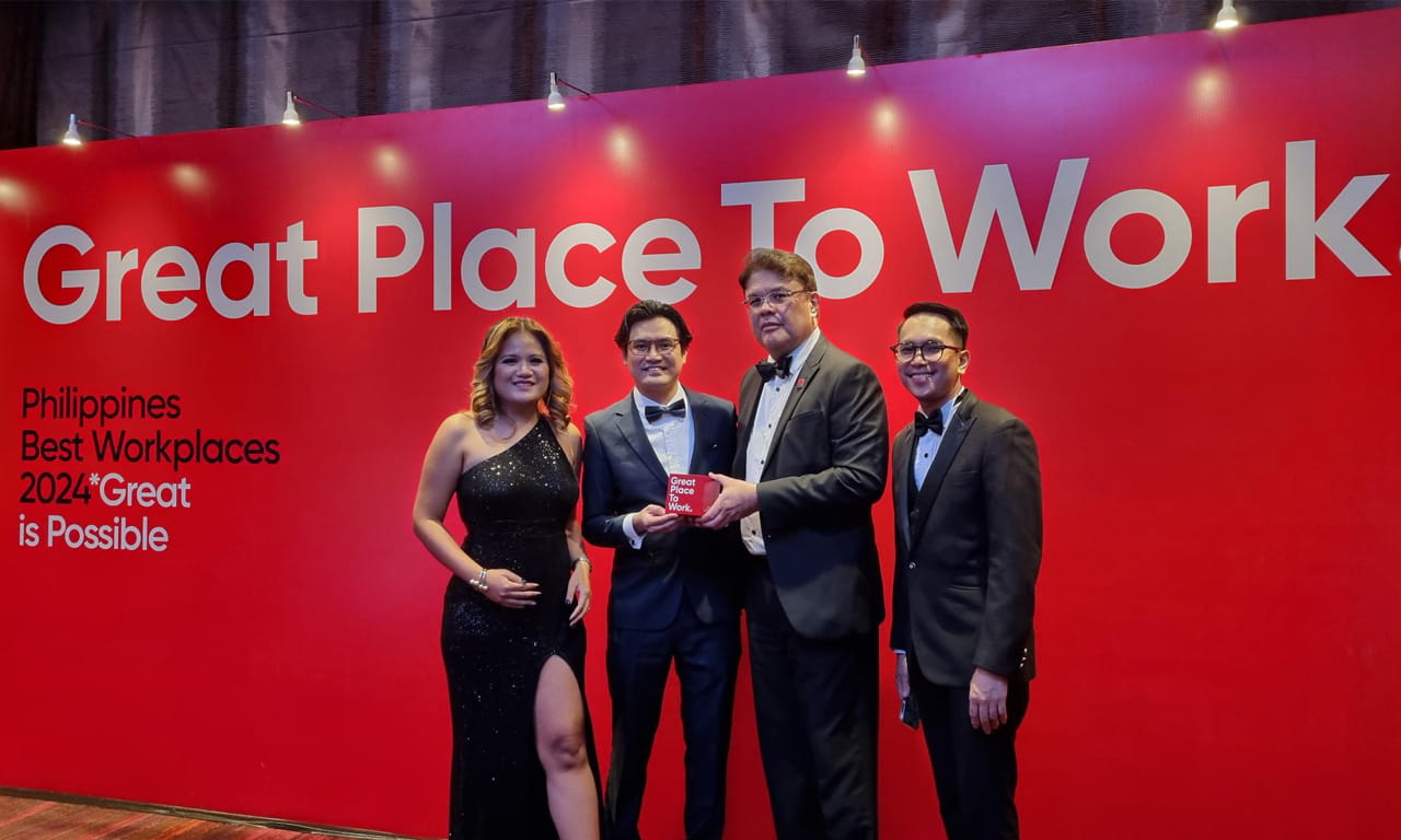 Aurecon Philippines employees accepting best workplace award.