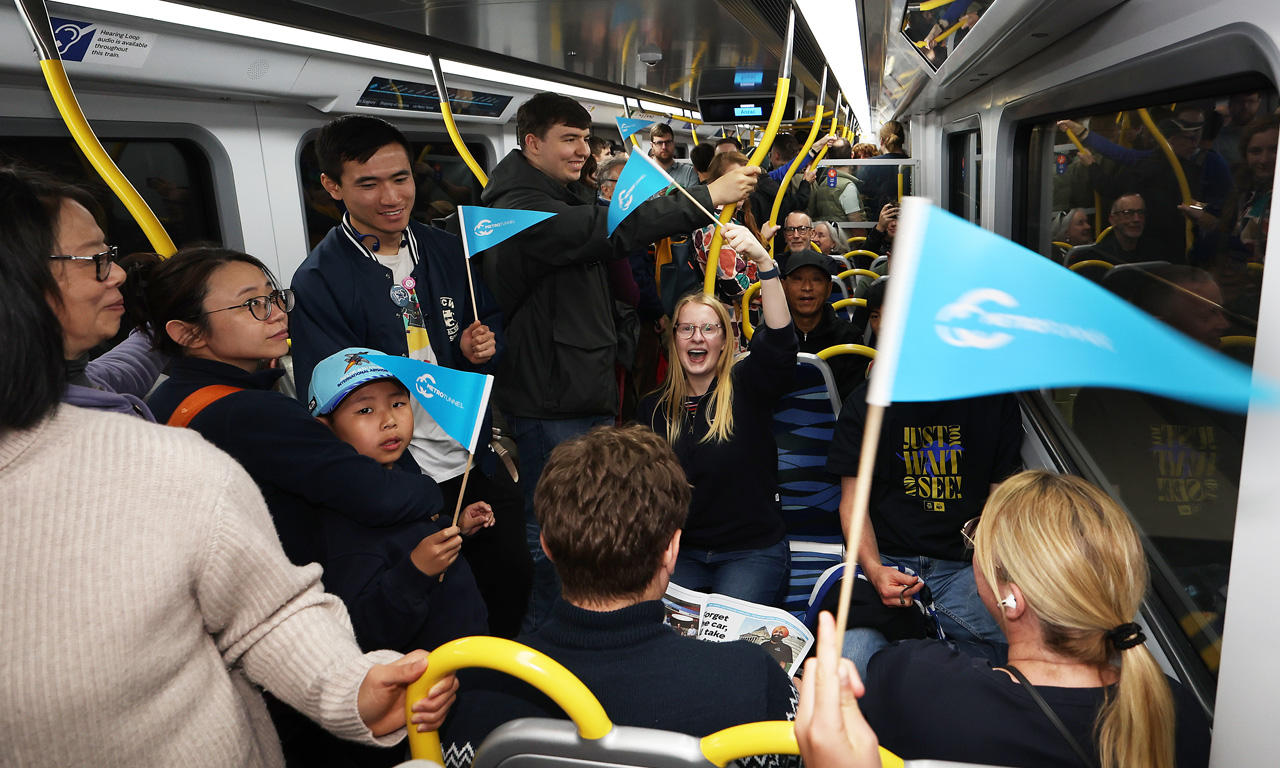 Melburnians riding train through Melbourne's Metro Tunnel on opening day, 30 November 2025.
