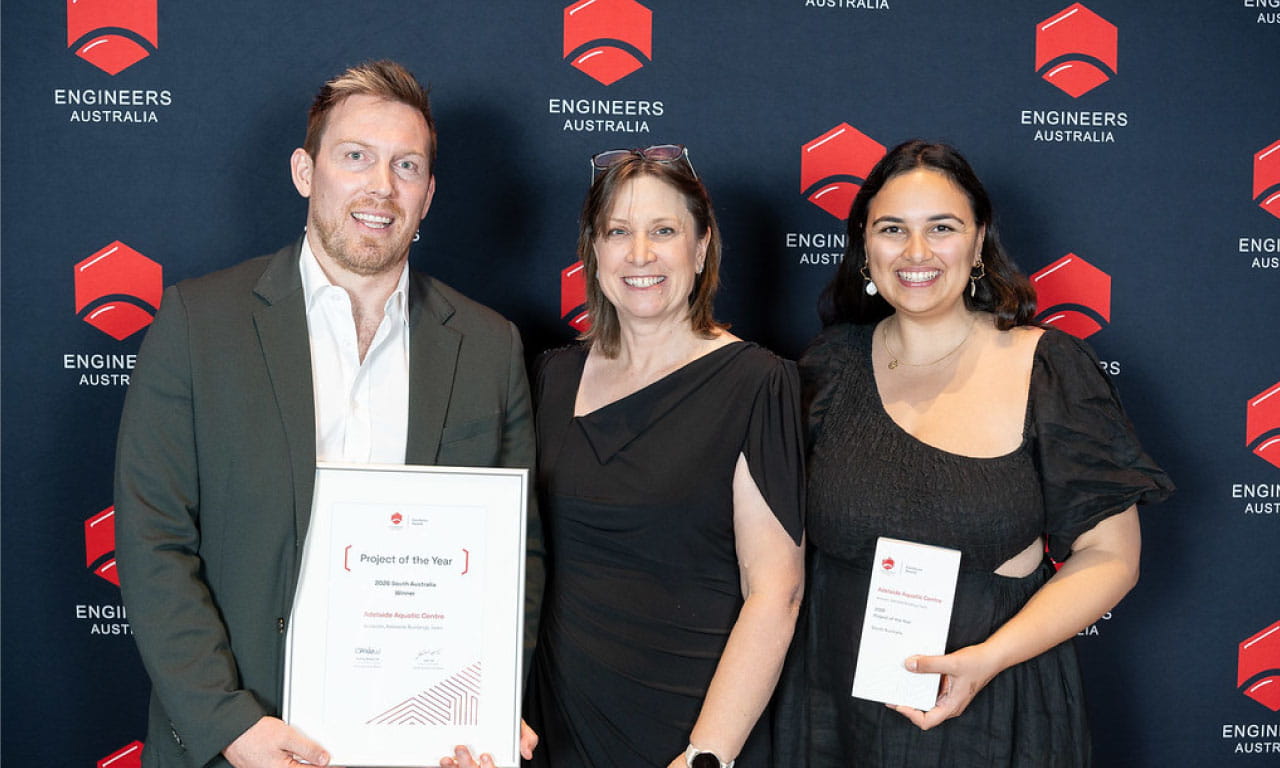 Corey McDonald (Buildings Leader, Adelaide, Aurecon), Bernadette Foley (Group Executive, Engineers Australia) and Aliy Pehlivanides (Design Manager, Aurecon) receive Project of the Year Award on behalf of Aurecon for Adelaide Aquatic Centre, one of Australia’s first large-scale, all-electric aquatic facilities, at the EA Excellence Awards (South Australia) 2026.