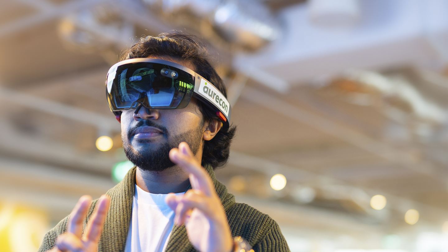 Aurecon employee wearing VR headset.