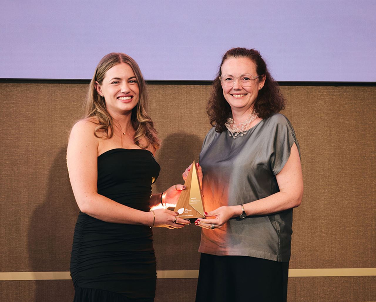 Sarah Mortimer accepts the Early Career Professionals Award at The Aurecons 2025.