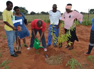 Ga Saleka Project Steering Committee members help the headmasters from local schools plant a tree during the launch of the Tree Project