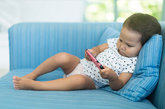 A baby using a smartphone