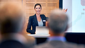 A woman presenting a report