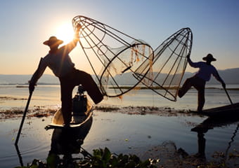 Fishermen who catch fish by using their leg to row the boat