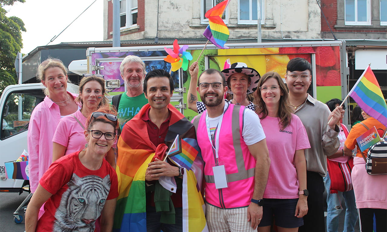 Our team walking under The Diversity Agenda banner at the Rainbow Parade NZ in Tāmaki Makaurau Auckland. 