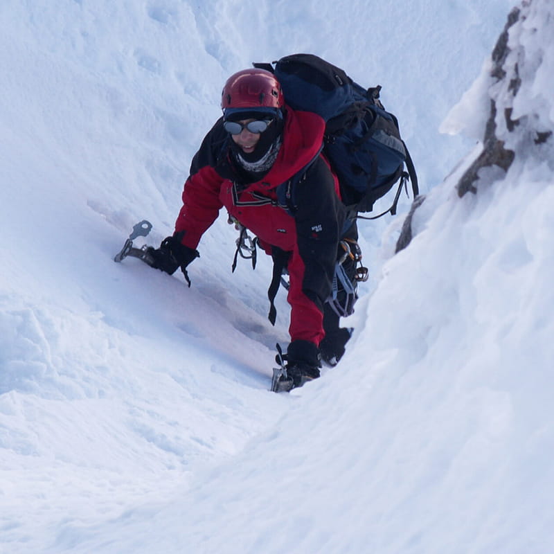 Jon Hind climbing a snowy mountain.