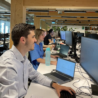 Hayden D'Addona from Aurecon working at his office desk
