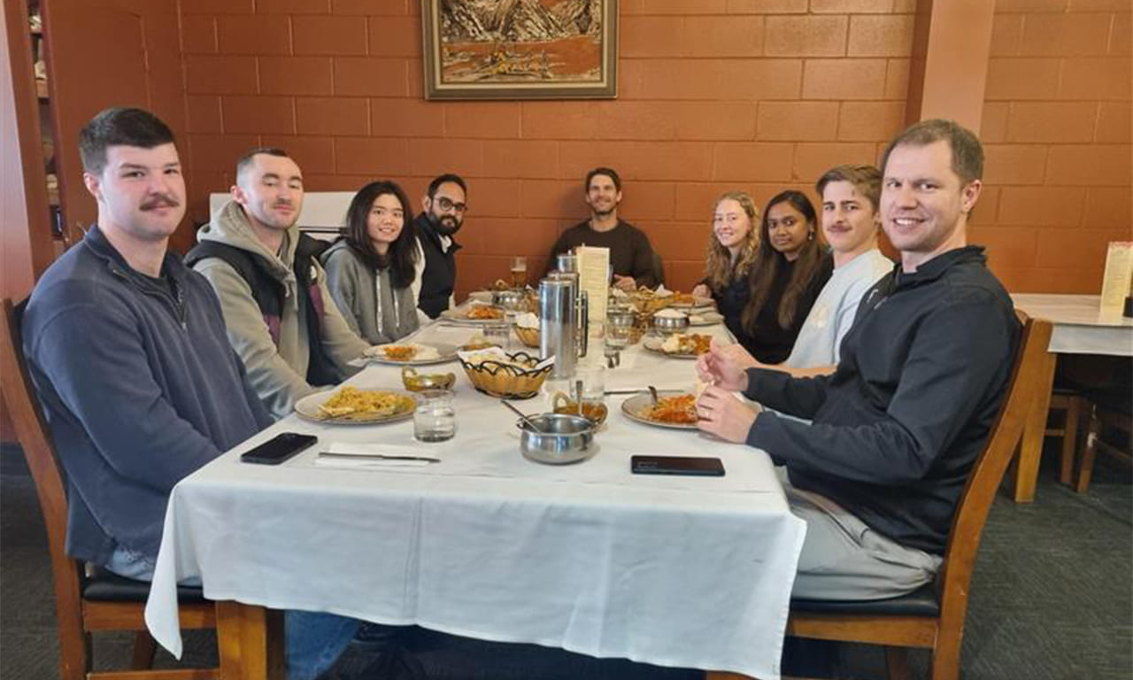 Enjoying curry lunch with the team.