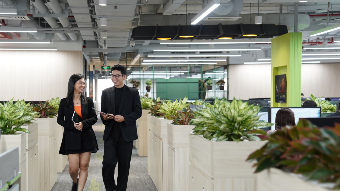 Aurecon employees walking through the Vietnam office.