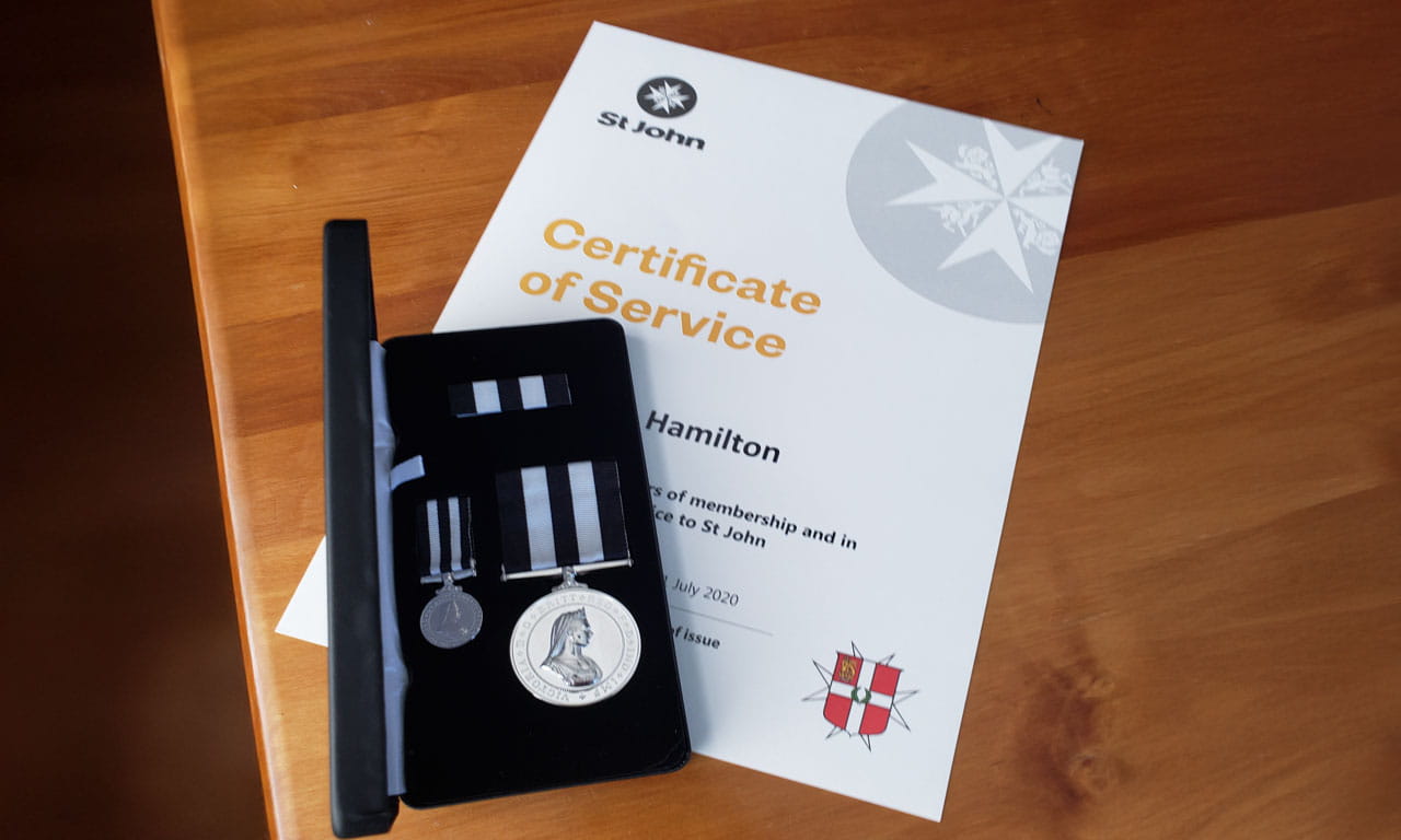Stuart Hamilton celebrating a decade of service with St John Ambulance Australia, receiving the prestigious Service Medal of the Order of St John.