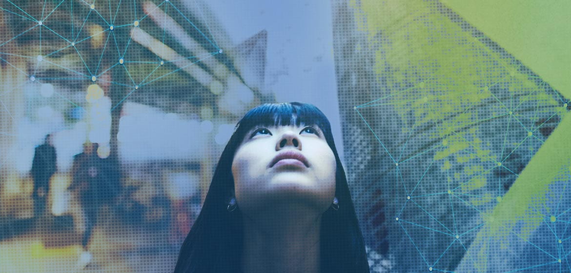 Asian girl looking up at Shanghai Tower