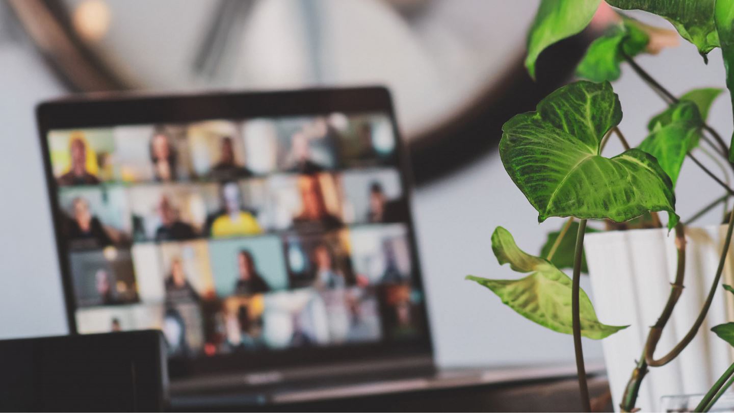 Desktop screen showing faces of people in Teams meeting