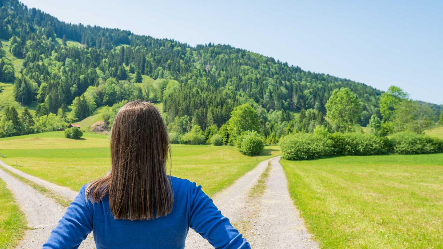 Adaptive planning  water strategy, woman standing at a crossroads.