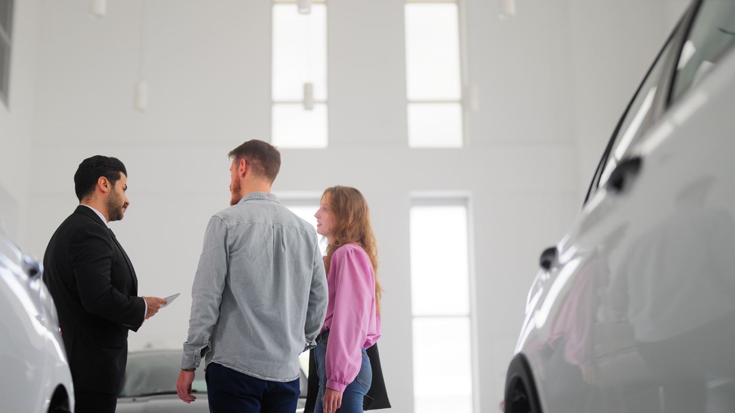  Couple talking to sales man for car insurance