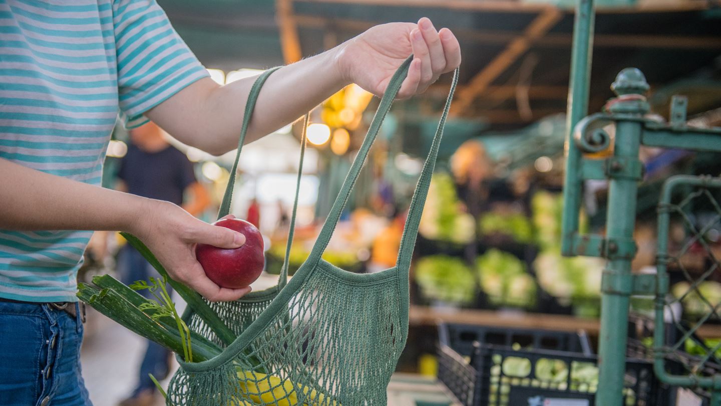 Woman buying apple