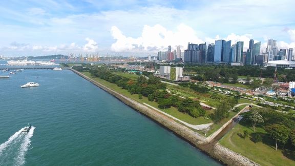 Aerial view of Singapore coastline with financial district background.