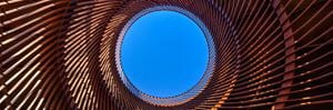 Blue sky and circular metal structure. Presenter images overlayed: Carsten Dethlefsen, Wayne Hubbard, Jodie Bricout.