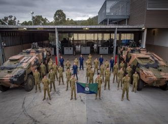 Australian Army soldiers undertaking training of the new Boxer Combat Renaissance Vehicles gather for a photo. Image courtesy of Australian Government Department of Defence.