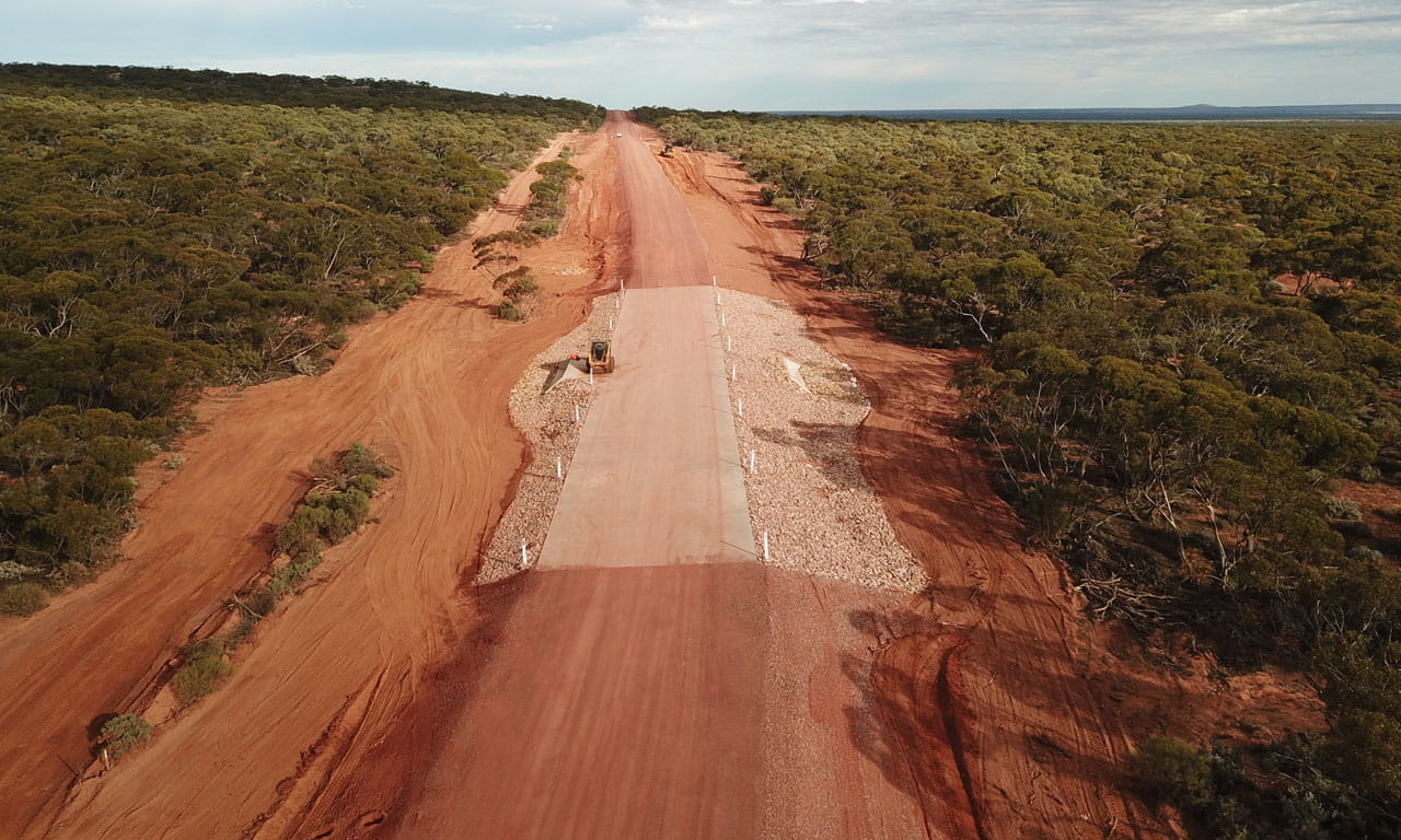 The refurbished road was elevated by 1.5 m in certain areas to protect against future flooding and erosion from wet weather.