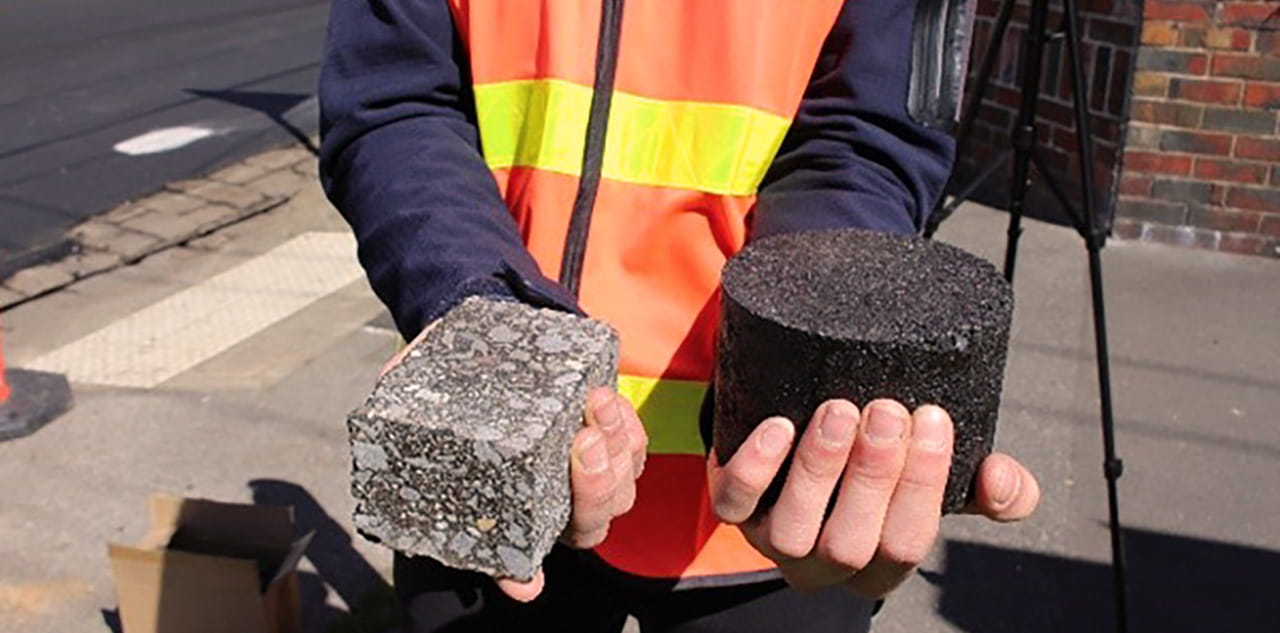 Aurecon worked with the ADF to innovate materials for base carparks and pavements by introducing recycled materials into the new infrastructure such as this new asphalt material standard showcased next to the standard.