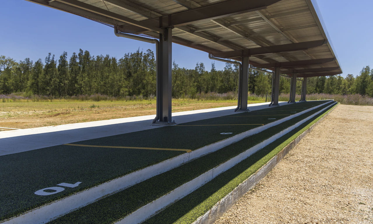 The training area have been transformed from dirt mounds in open areas to facilities constructed from concrete pads with soft fall (rubber) overlays and covered roofs.