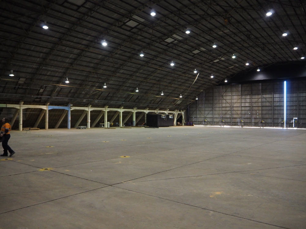 Woomera Hangar Maintenance Project's  purpose was to re-attach all of the roof sheeting while allowing Base to continue operations as required