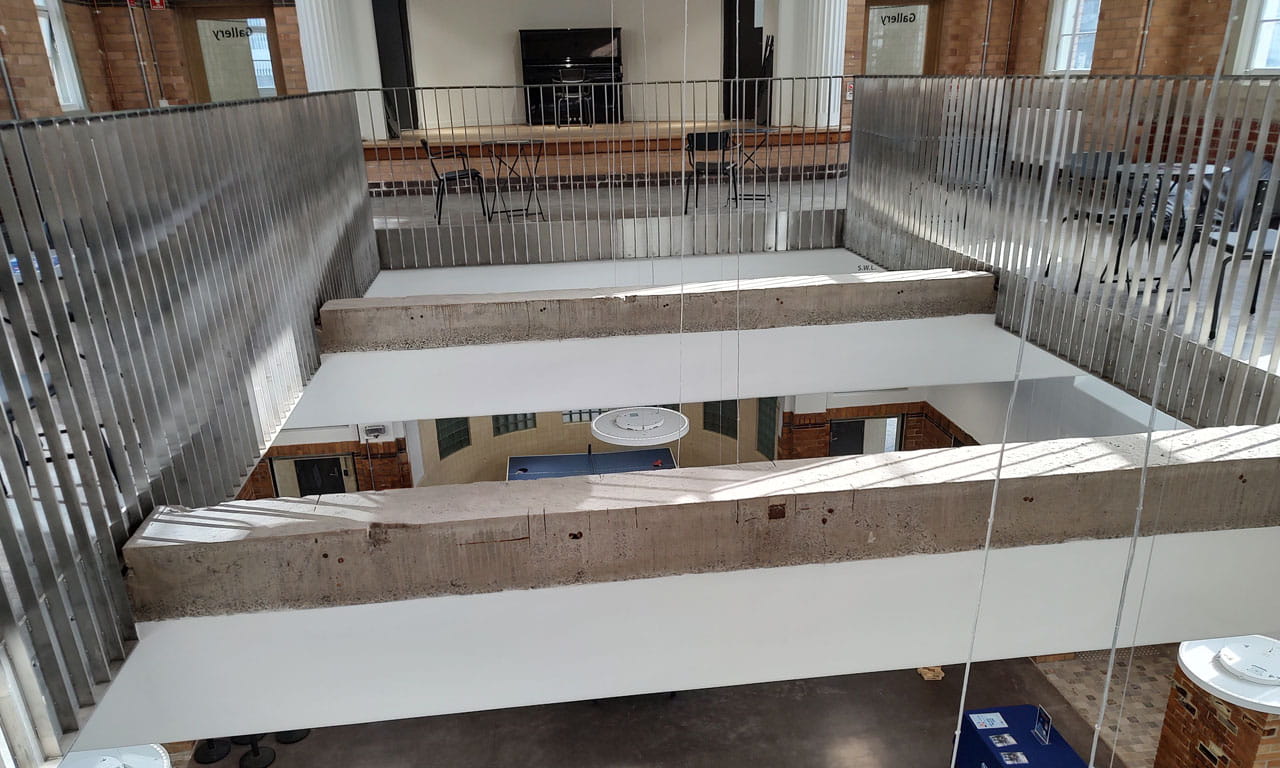 Inside Building 189, its lower level excavated from beneath ground level and restored into student meeting spaces.