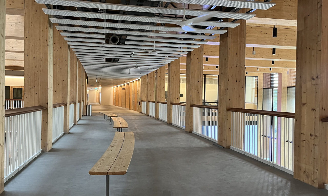 The entire building is approximately 220m long, with a simple and efficient modular timber frame system.