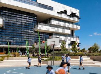 As well as indoor sports courts and a gym, the building boasts a netted outdoor sports area on level two. Image courtesy of VSBA.