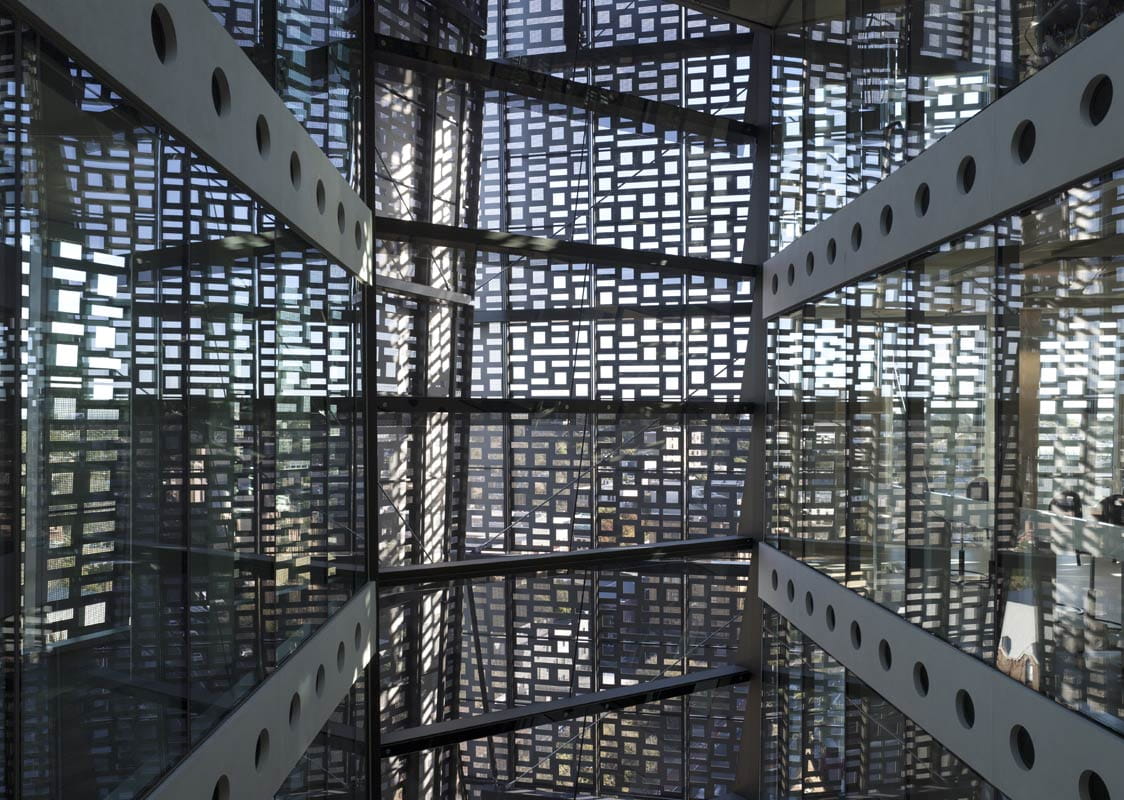 The University of Technology Sydney building's binary screen facade provides shading and glare control.
