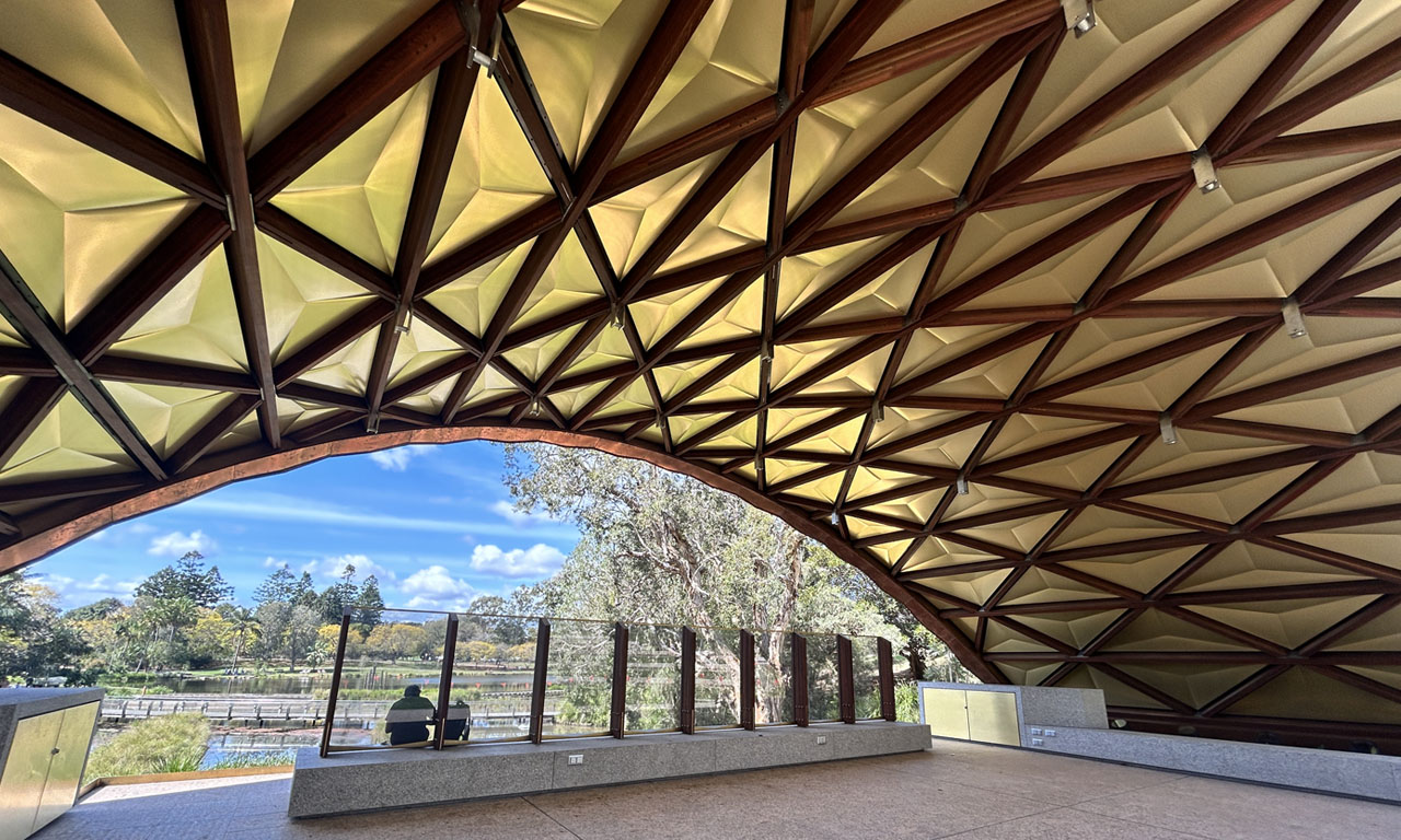 The timber structure offers a shaded area for people to engage with UQ's signature lake and amphitheatre precinct.