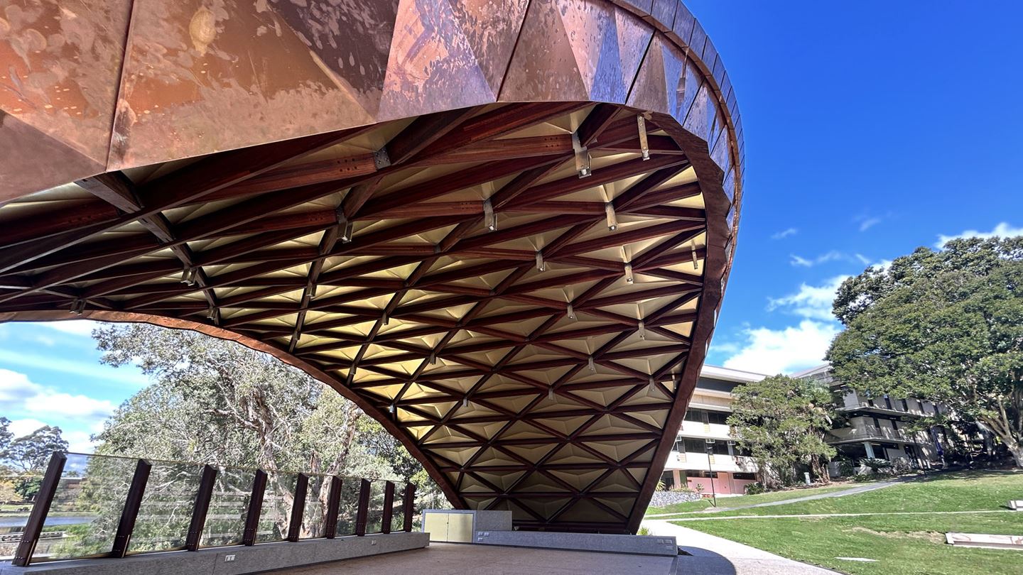 The UQ Soundshell during the daytime, featuring its distinctive copper facade.