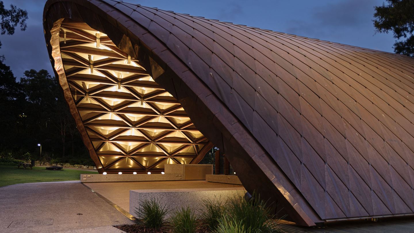 UQ Soundshell: The curved steel arches and diamond-patterned glulam timber roofing create a visually striking form that is both robust and sustainable.