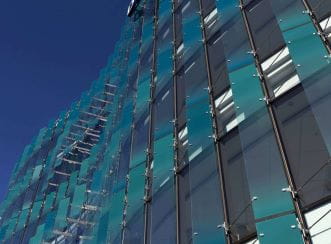 The fully glazed facade of 151 Cambridge Terrace building has energy efficiency solar shading and heat recovery systems.