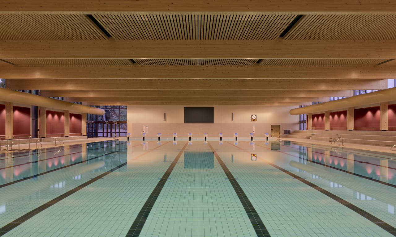 Mass timber used throughout the Adelaide Aquatic Centre reduces corrosion risk and maintenance compared with conventional steel structures. Image courtesy of DIT.