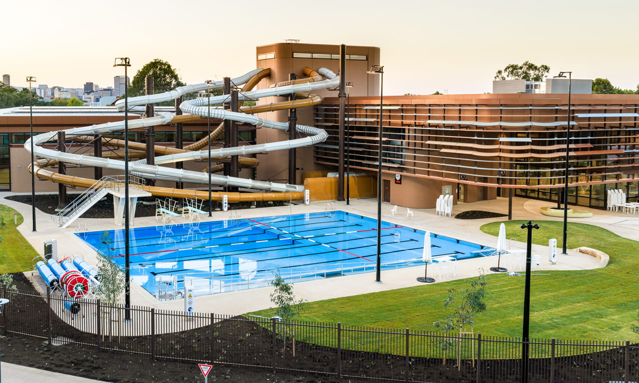 Outdoor splash pad and waterplay area, 25-metre 8-lane outdoor pool and waterslides at the Adelaide Aquatic Centre.