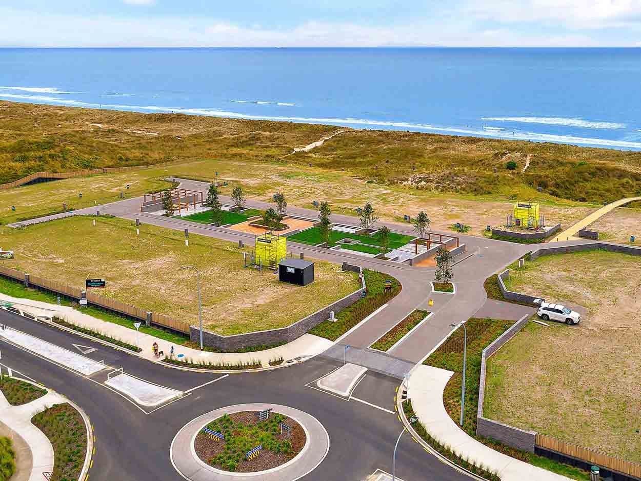 Aurecon used Nikau palm feature planting and sculptural outdoor showers that complements the coastal location.