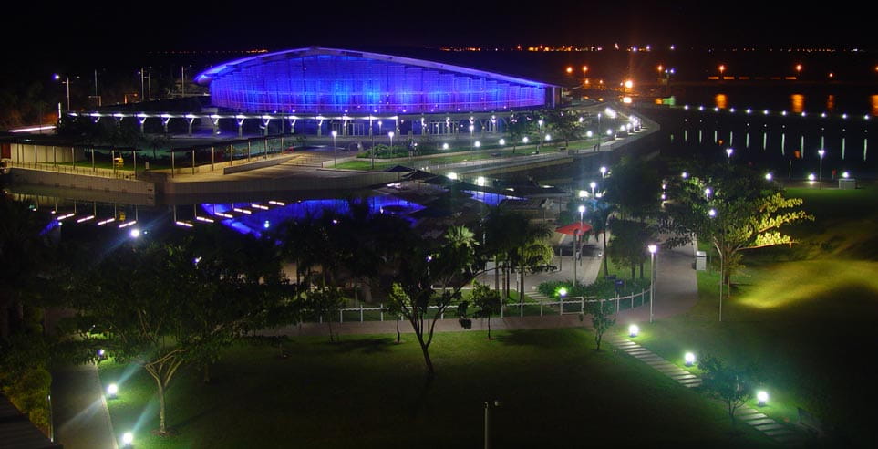 Darwin Exhibition and Convention Centre, part of the Darwin Waterfront precinct, shown here lit up at night.