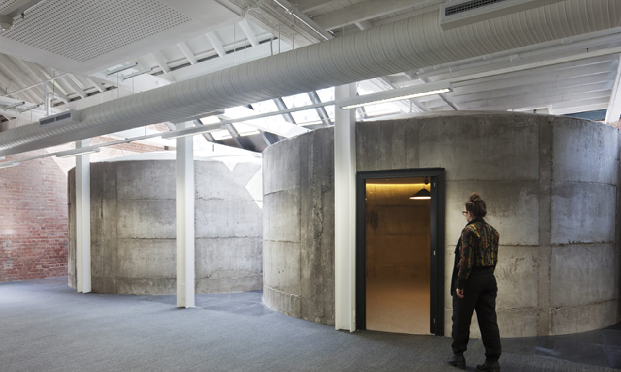 Aurecon found ways to incorporate the original malt tanks into a modern office environment.