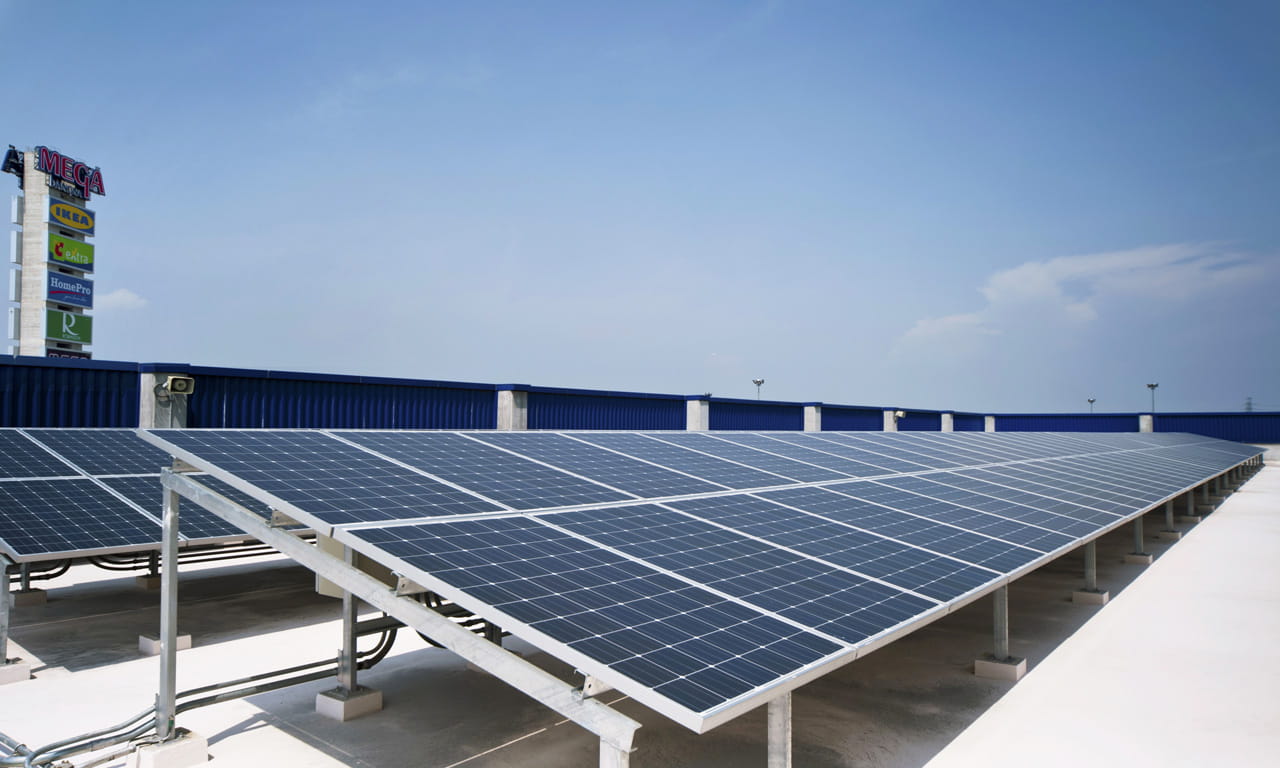 Installation of solar panels at the rooftop of IKEA, Megabangna mall, to feed electricity into the city grid.