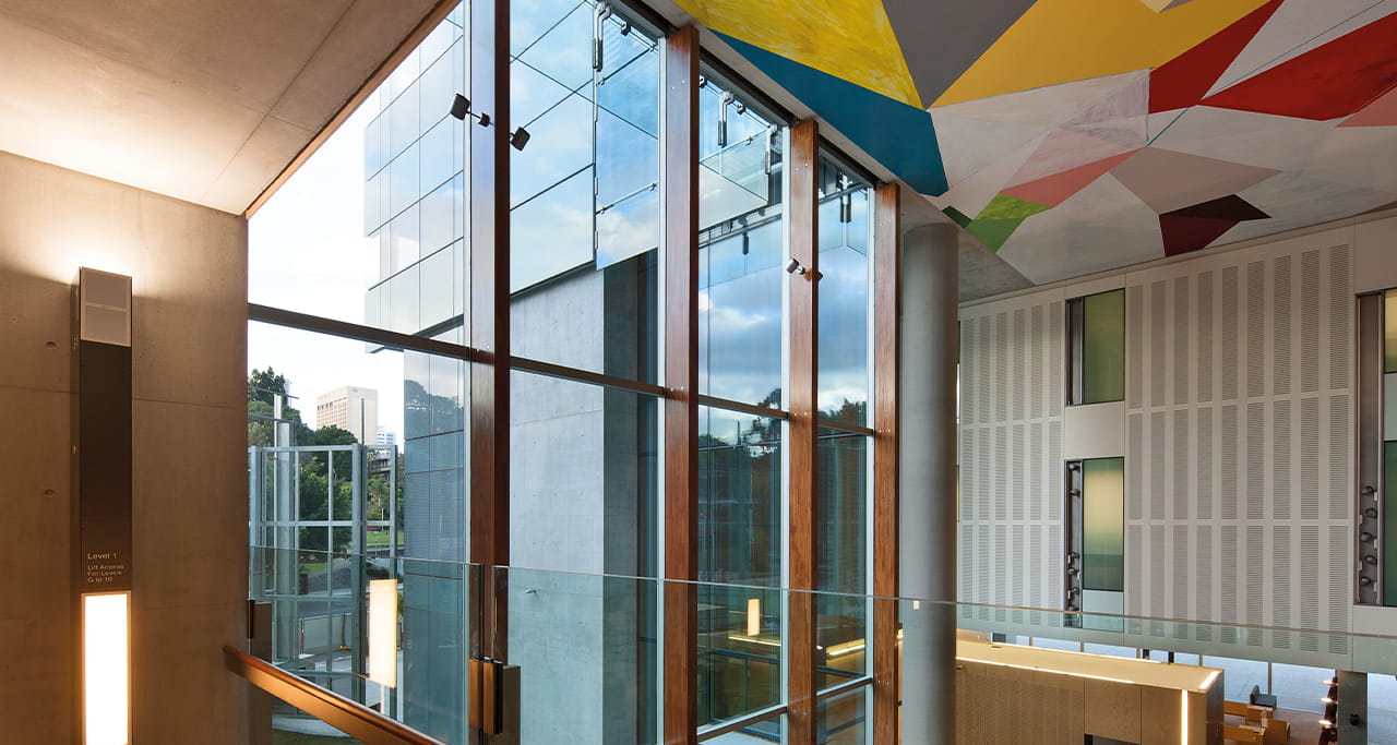 Highlighting the innovative use of indirect emergency lighting at Queen Elizabeth II Courts of Law.