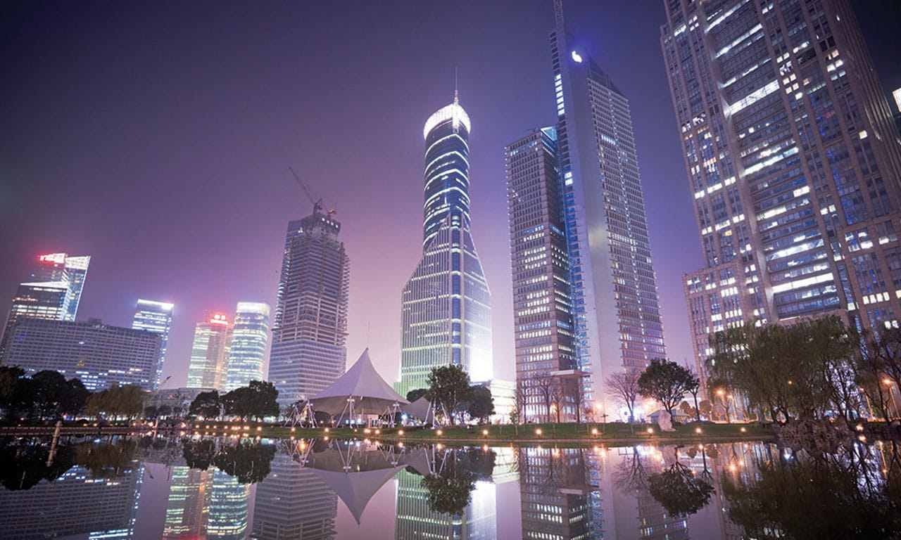 A view of Shanghai Tower in the distance, at night.