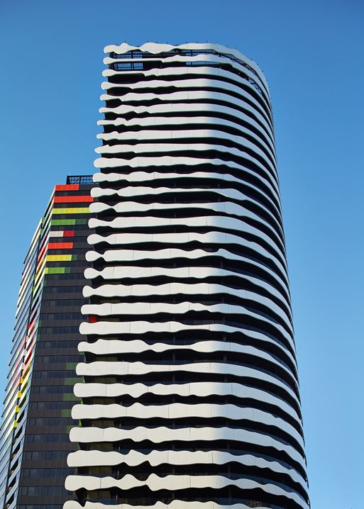 Swanston Square Apartment Tower: the facade consists of black cladding contrasted with 6-metre long white panels to make the impression of Aboriginal artist, Elder William Barak.