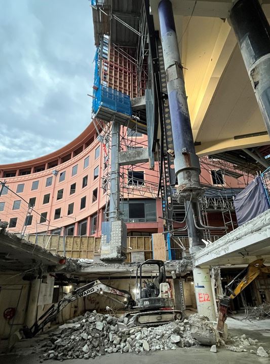 The base isolation system incorporates isolators, allowing the entire building to move independently from ground motion.