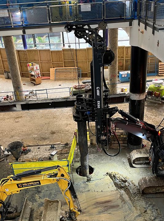 Aurecon's innovative solution relocated piling operations to ground floor level (floor above), then selectively demolished floor sections to provide rig access.