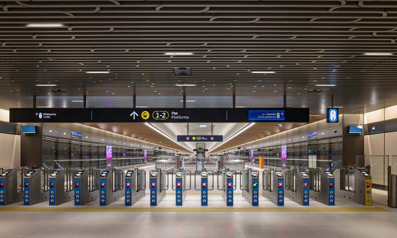 The ticket gate concourse inside Te Waihorotiu Station, a new underground transit hub on the City Rail Link in Auckland, New Zealand.