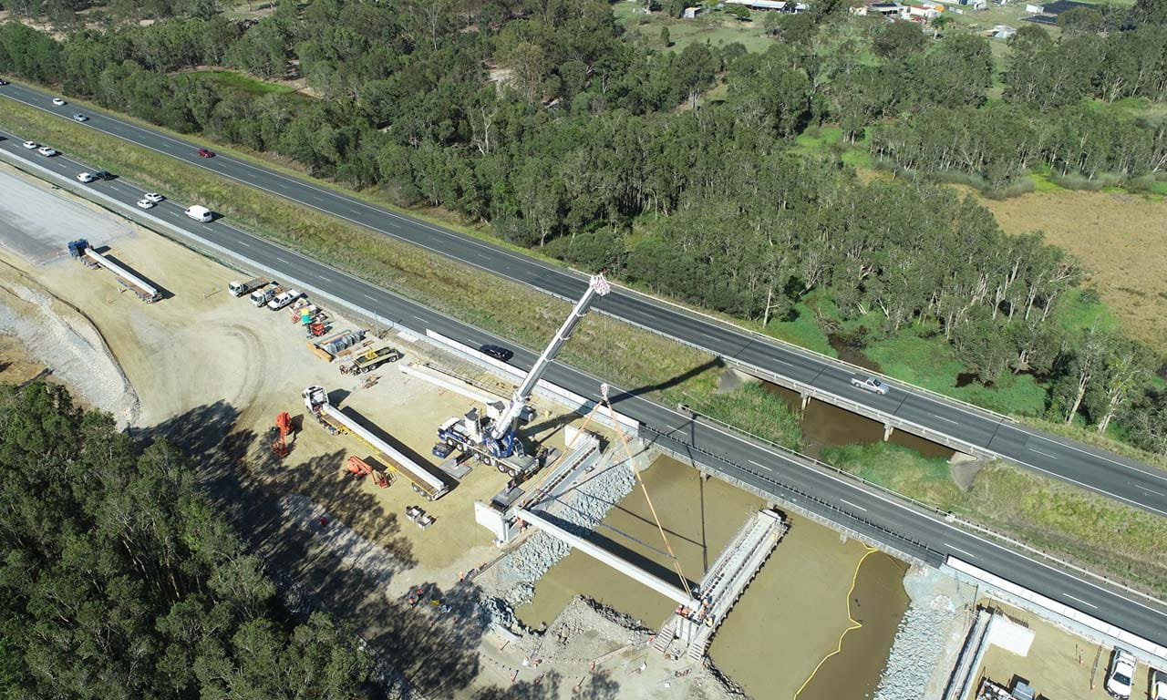 Installing bridge girders for the new southbound Bruce Highway carriageway.